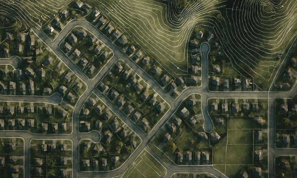 Aerial view of a neighborhood with contour lines that resemble the elevation details shown in a topo survey