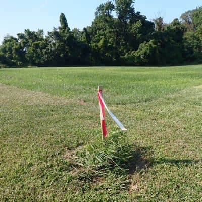 Property corner marker located by a licensed land surveyor
