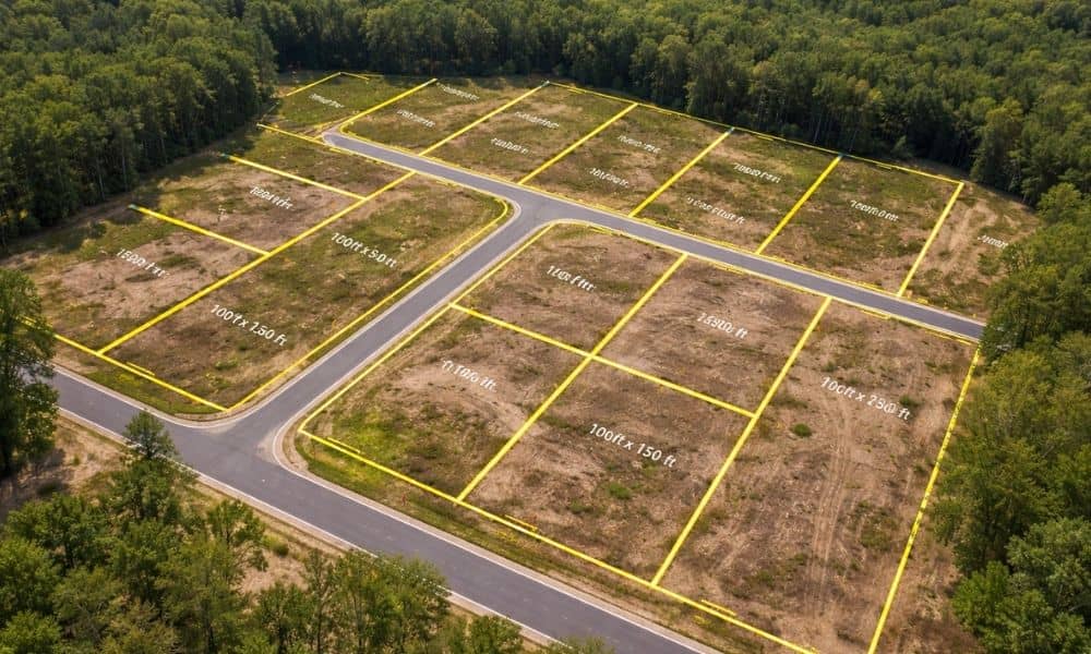 Aerial view of a land subdivision showing lot boundaries and measurements from a lot survey used for planning and layout