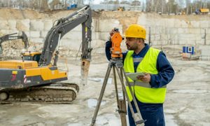 Construction surveyor using a total station on a construction site in Bridgeport, WV